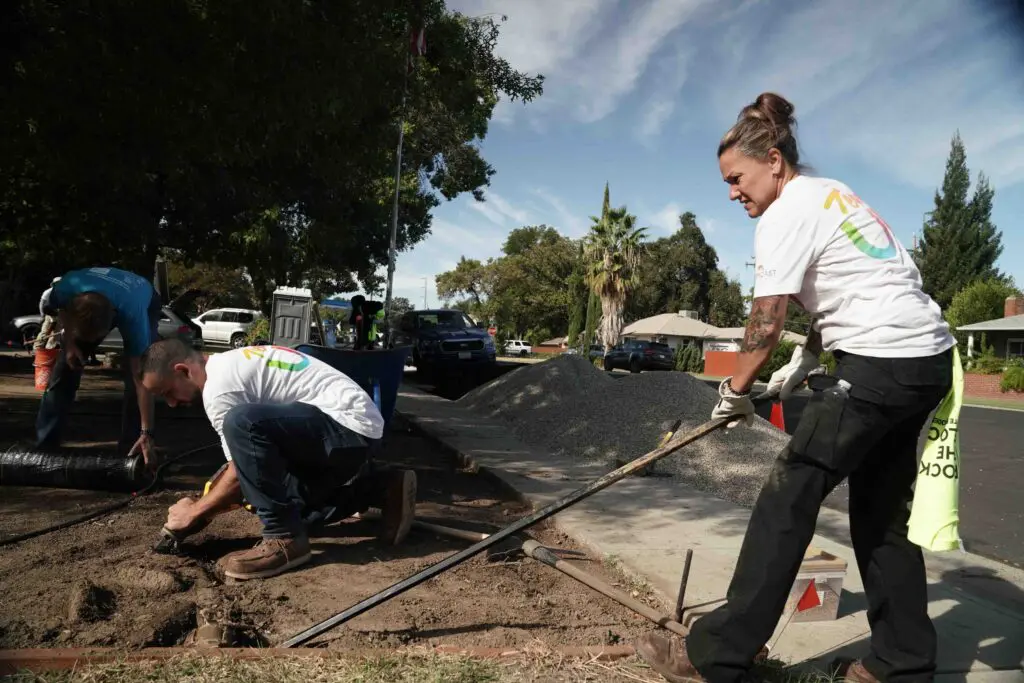 Team UP, Comcast's employee volunteers at a homesite during Rock the Block an event organized by Habitat for Humanity in West Sacramento on Friday, Oct. 11, 2024 in Sacramento, Calif.