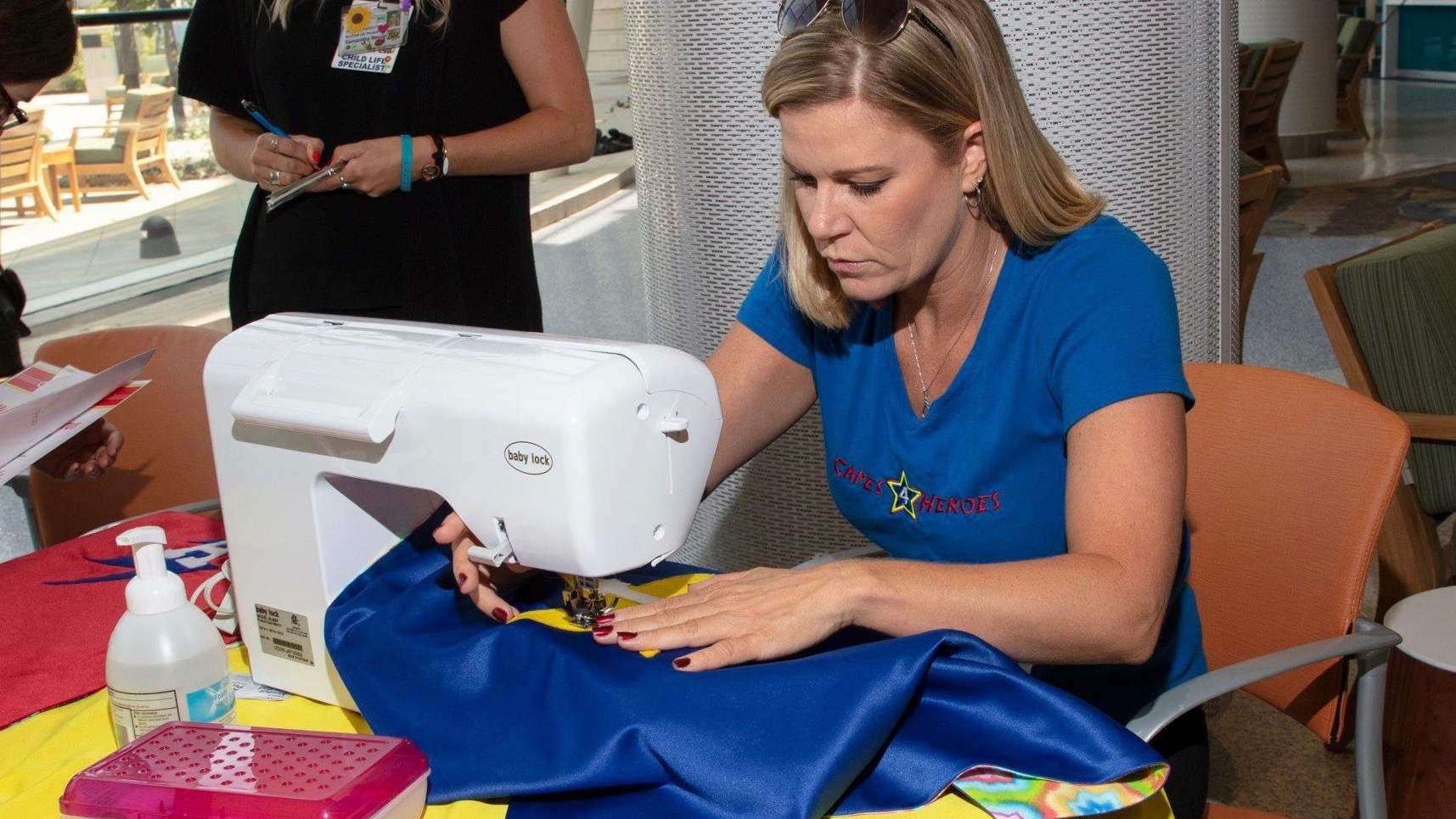 A woman sewing some clothes