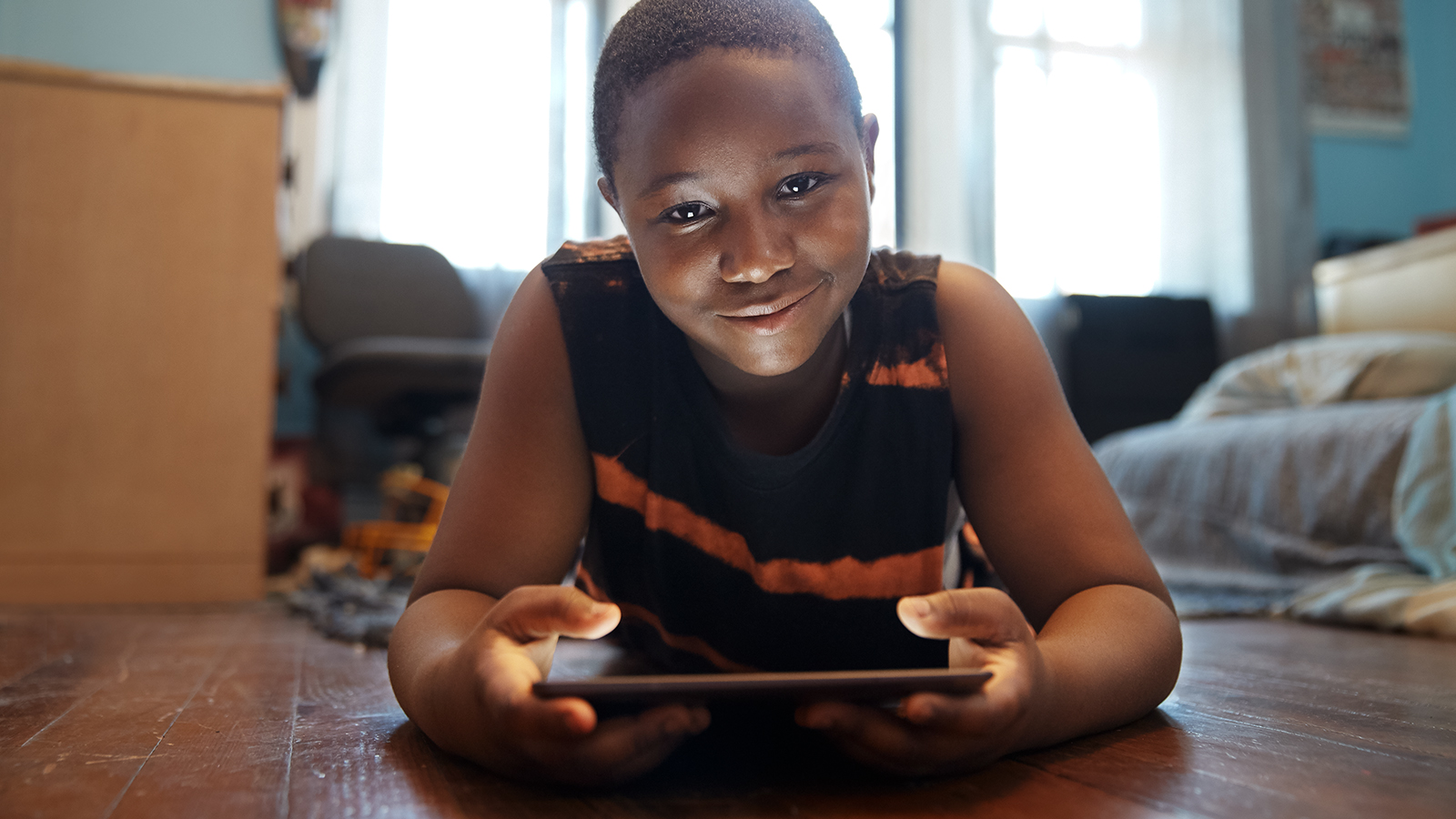 Young boy trying out 'internet essentials'