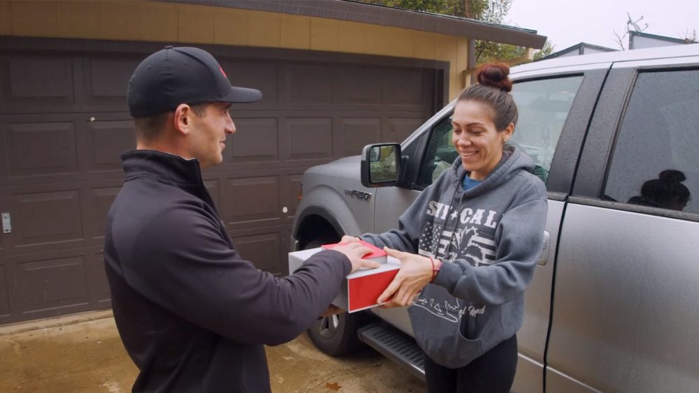 An Xfinity technician helps a customer.