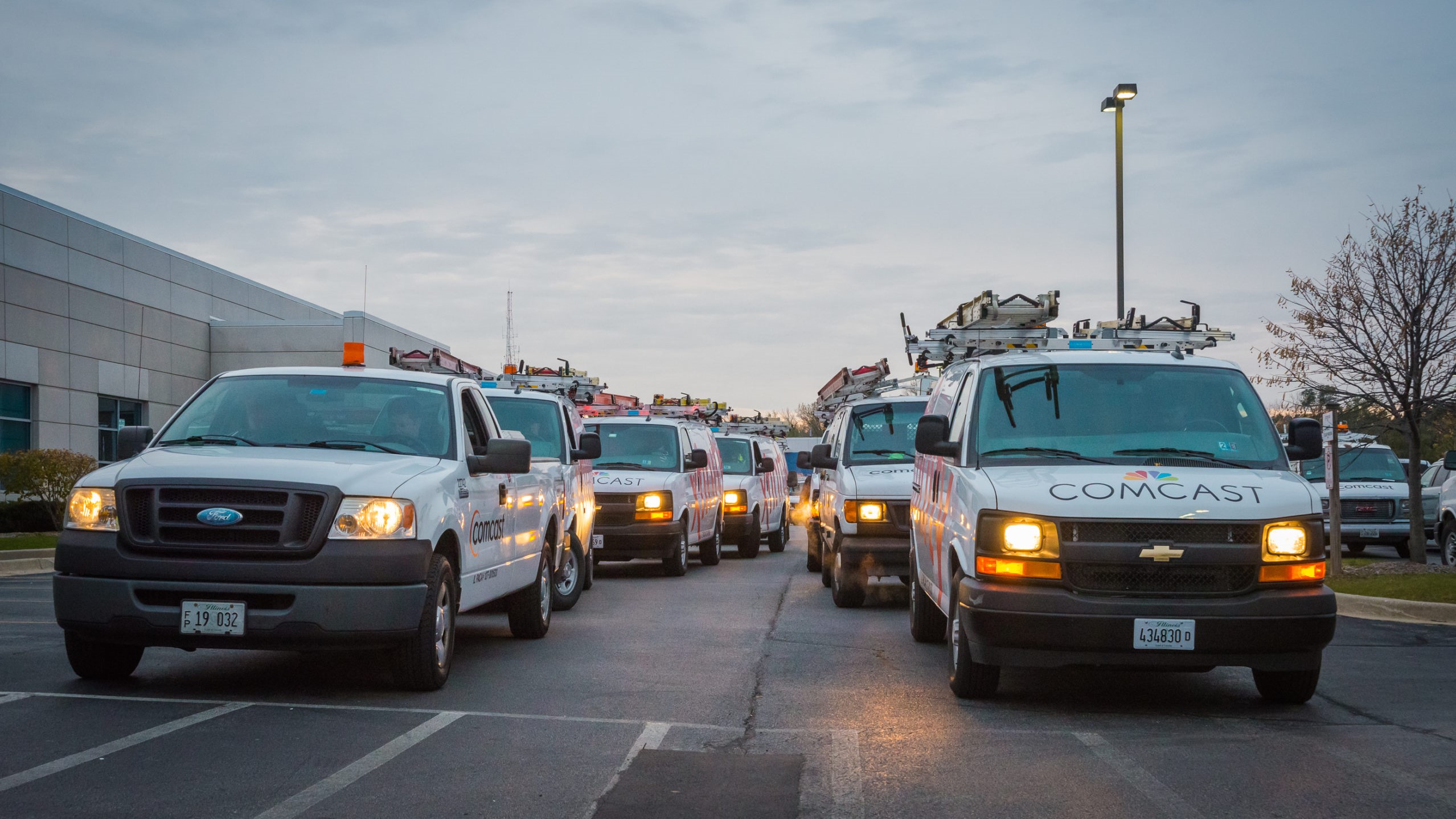 Comcast technicians in their vans