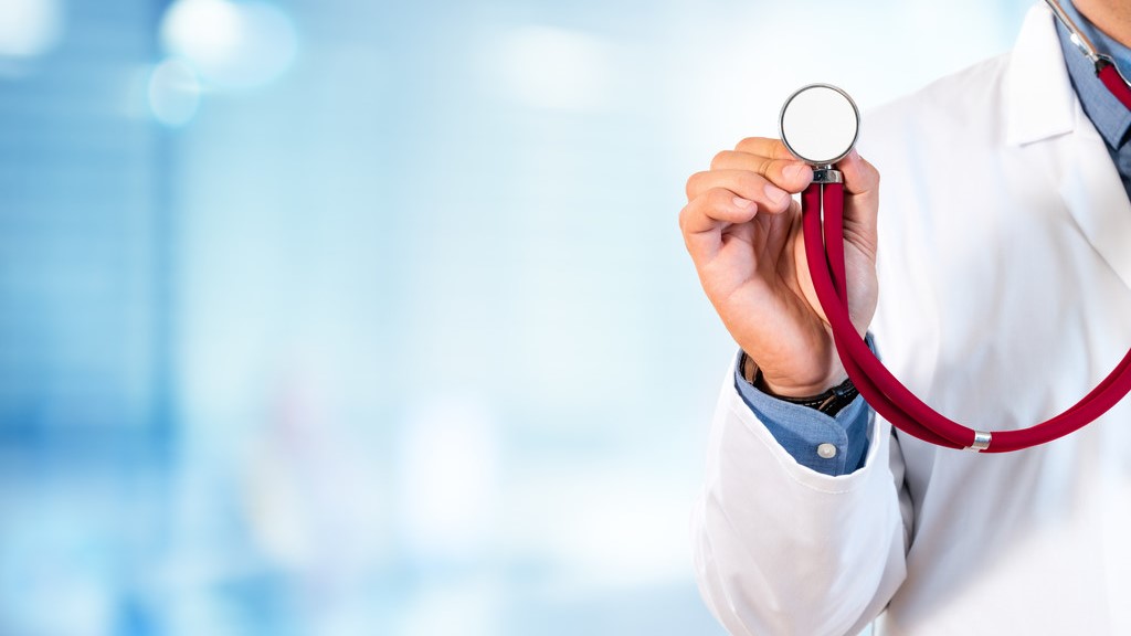 A doctor holds a stethescope.