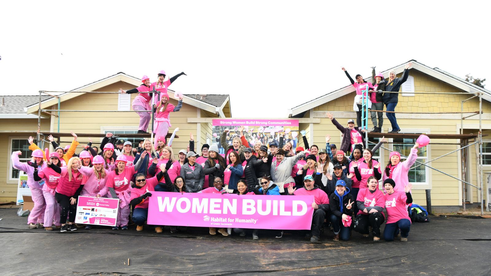 Comcast volunteers for Habitat for Humanity's Women Build help build a home during a Team UP event on Friday, March 1, 2023 in Sacramento, Calif.