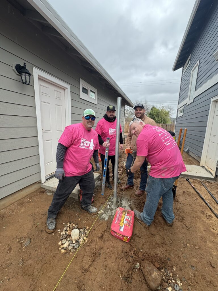 Comcast volunteers for Habitat for Humanity's Women Build help build a home during a Team UP event on Friday, March 1, 2023 in Sacramento, Calif.