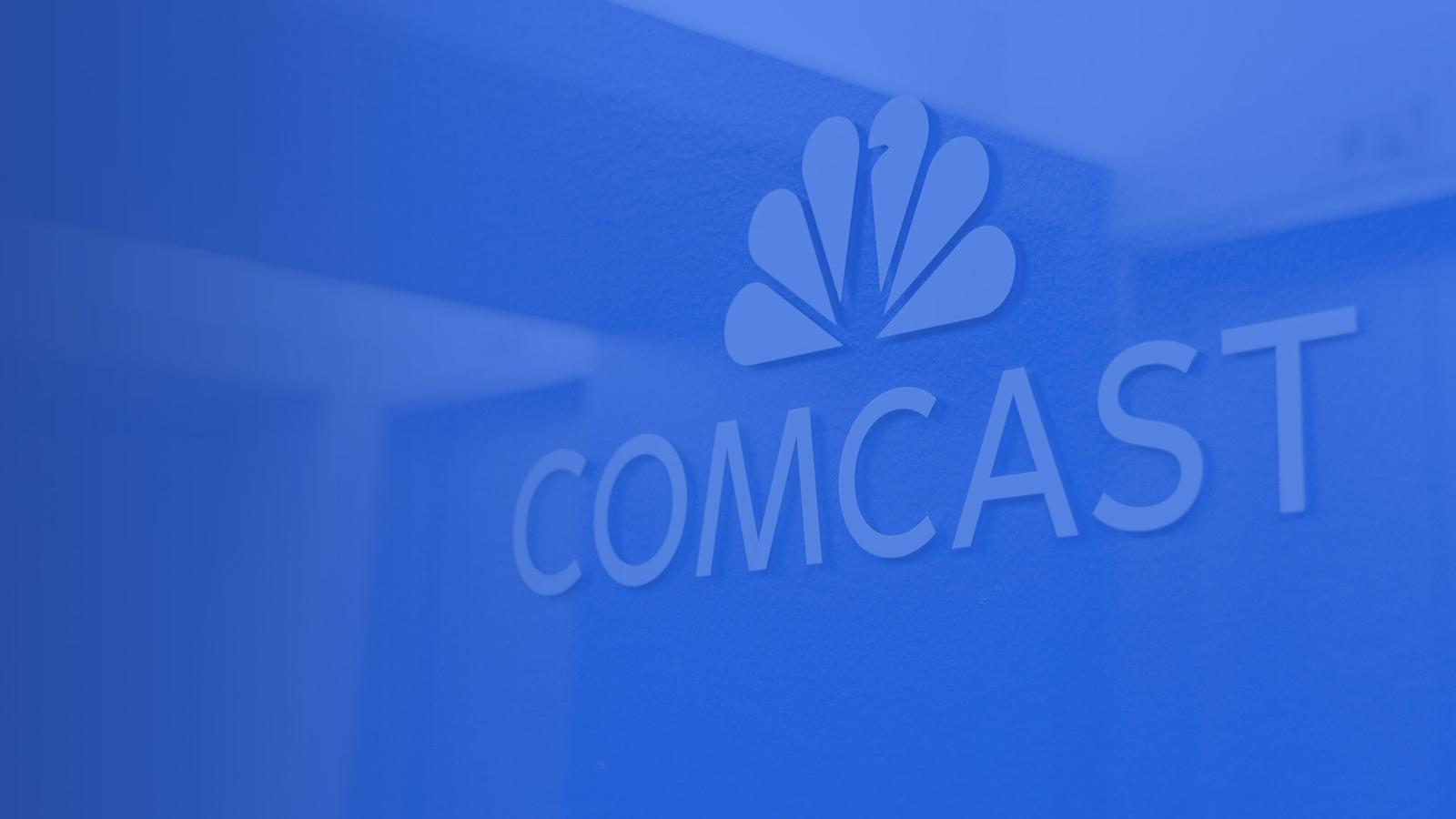 Comcast logo with blue overlay