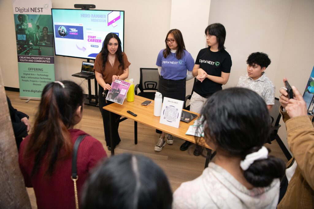 Hassyel Rangel, far left, explains to visitor above web learning opportunities at Digital Nest. Digital Nest held its grand opening at its fifth location on Friday, January 24, 2025 in Stockton, CA. Comcast gave them a $200,000 check at the event. (Anne Chadwick Williams/Comcast)