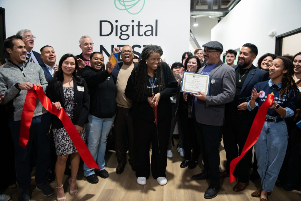 Dr. Alicia Perry, Digital Nest’s Stockton site director cuts the ribbon at its grand opening at its fifth location on Friday, January 24, 2025 in Stockton, CA. (Anne Chadwick Williams/Comcast)