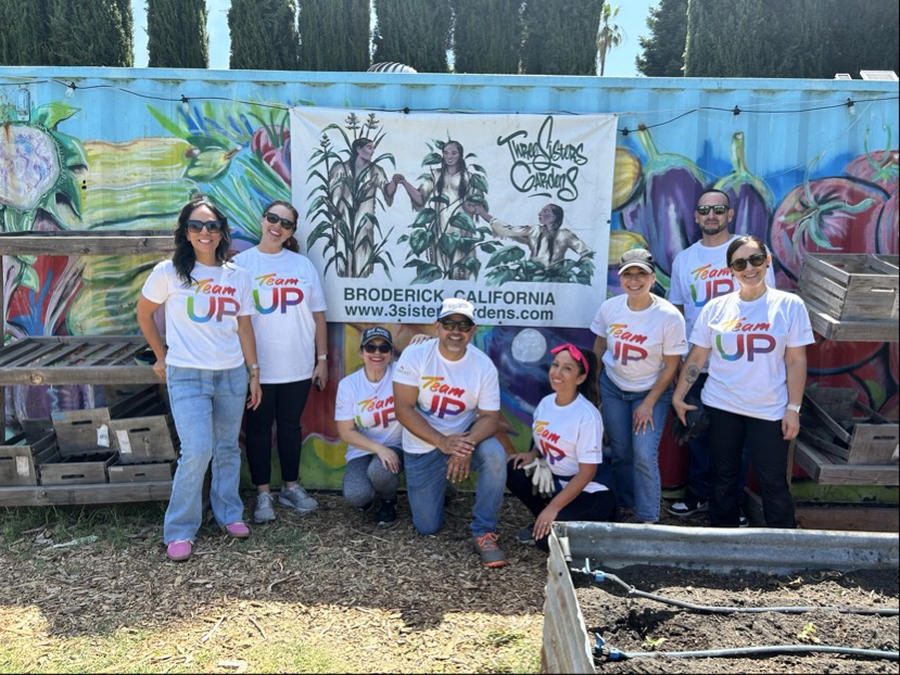 Comcast employees volunteer at Three Sisters Gardens in West Sacramento, California