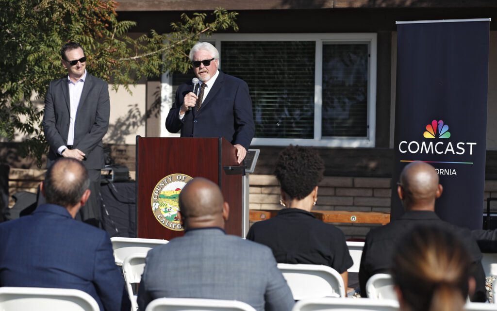 Supervisor Doug Verboon speaks at Comcast's groundbreaking ceremony in Kings County, Calif.