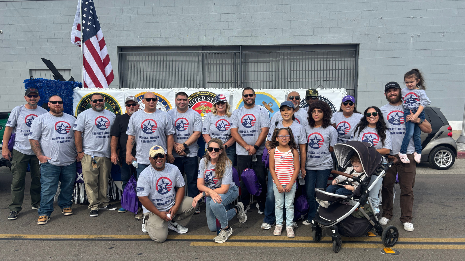 Comcast employees march in the 106th Central Valley Veterans Day Parade in Fresno, Calif. on November 11, 2025.
